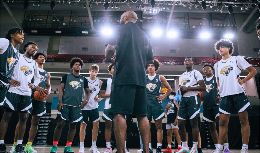 An image of a basketball team in a huddle.